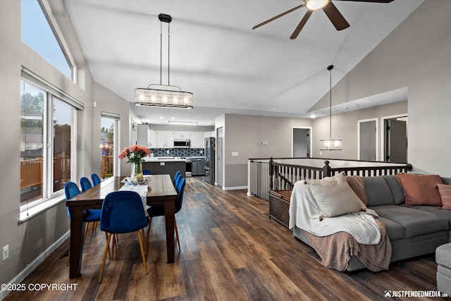 800 Howard Cir, Anchorage, AK 99504 - dining room featuring a chandelier, a ceiling fan, high vaulted ceiling, dark wood-style floors, and baseboards