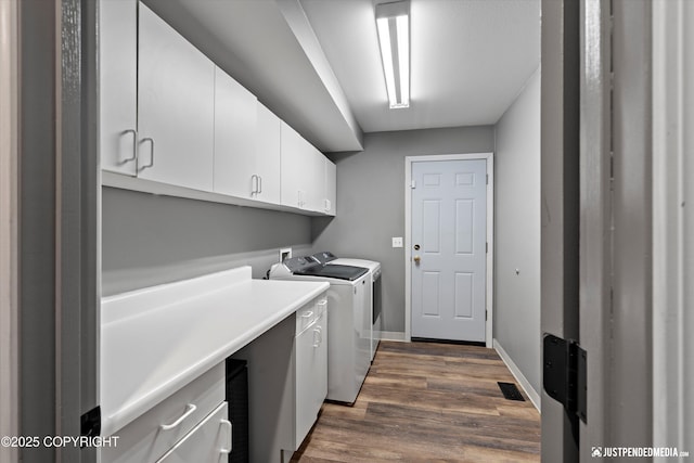 800 Howard Cir, Anchorage, AK 99504 - laundry area featuring cabinet space, washing machine and clothes dryer, dark wood-type flooring, and baseboards