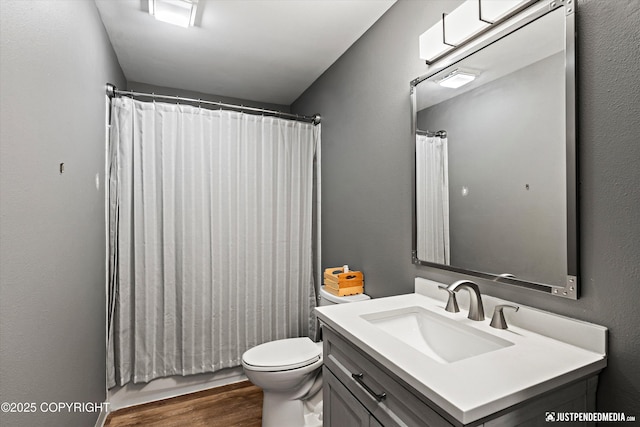 800 Howard Cir, Anchorage, AK 99504 - full bathroom featuring vanity, wood finished floors, toilet, and a shower with curtain