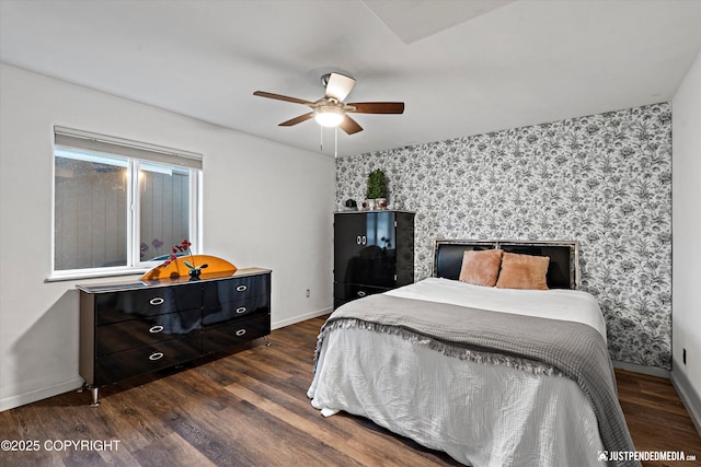 800 Howard Cir, Anchorage, AK 99504 - bedroom featuring wallpapered walls, dark wood-type flooring, baseboards, an accent wall, and a ceiling fan