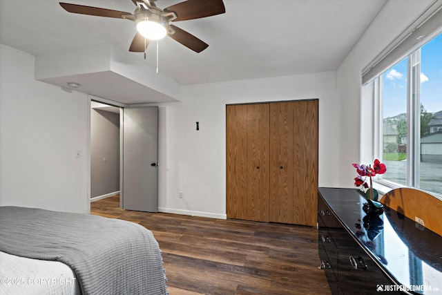 800 Howard Cir, Anchorage, AK 99504 - bedroom with dark wood finished floors, baseboards, ceiling fan, and a closet