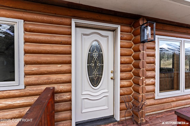 3915 Hiland Rd, Eagle River, AK 99577 - view of exterior entry featuring faux log siding