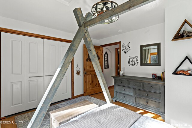 3915 Hiland Rd, Eagle River, AK 99577 - bedroom featuring wood finished floors and a closet