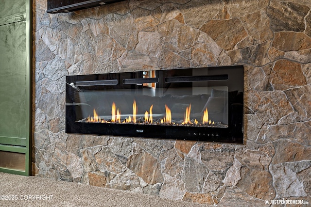 3915 Hiland Rd, Eagle River, AK 99577 - detailed view of a lit fireplace