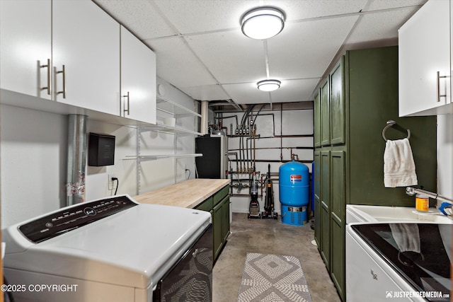 3915 Hiland Rd, Eagle River, AK 99577 - kitchen featuring green cabinets, a paneled ceiling, concrete floors, white cabinets, and open shelves