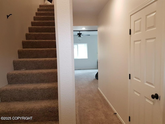 stairway with baseboards, recessed lighting, carpet, and ceiling fan