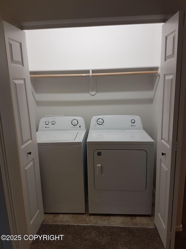 laundry room with laundry area, tile patterned flooring, and washing machine and clothes dryer