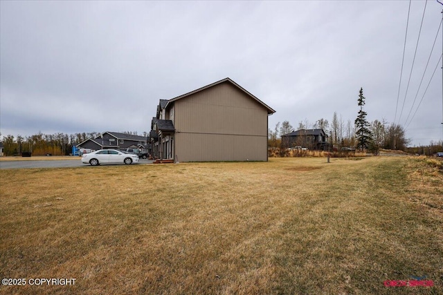 view of home's exterior featuring a lawn