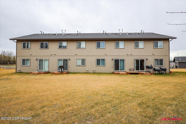 back of house with a lawn and a patio area
