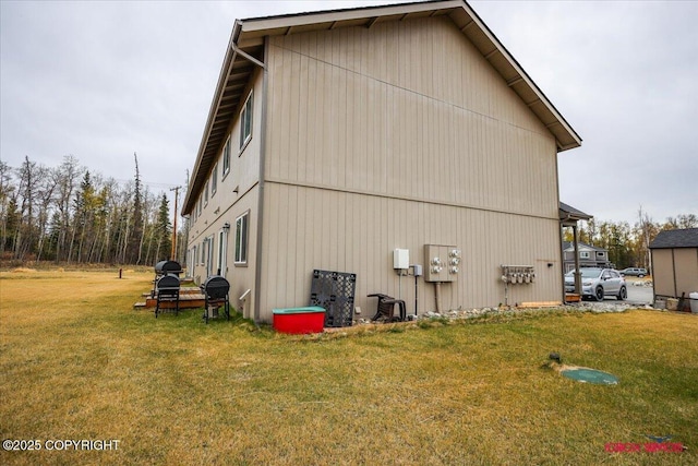 view of home's exterior with a lawn