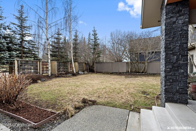 view of yard with a fenced backyard