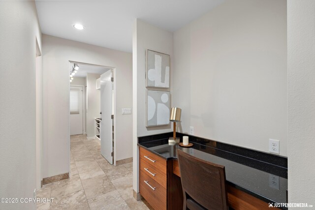 unfurnished office with baseboards