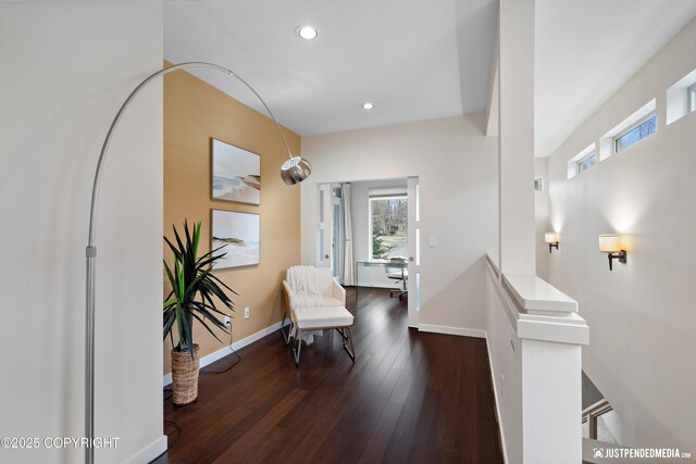 sitting room with baseboards, recessed lighting, and wood finished floors