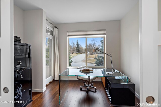 office area featuring baseboards and dark wood finished floors