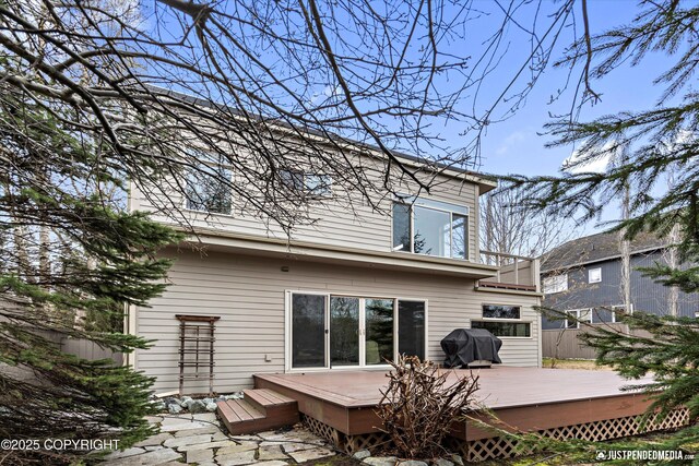 rear view of property with a deck