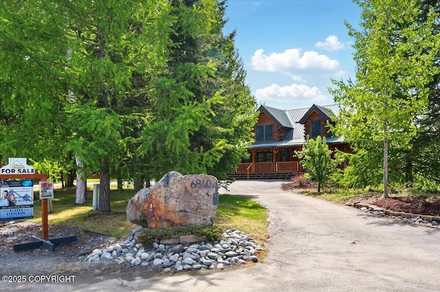 6840 S Frontier Dr, Wasilla, AK 99623 - view of front of property with a porch and metal roof