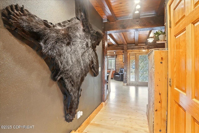 17720 Werre St, Chugiak, AK 99567 - corridor with beamed ceiling, rustic walls, light wood-type flooring, wooden ceiling, and baseboards