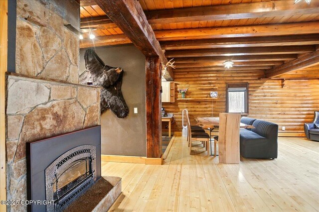 17720 Werre St, Chugiak, AK 99567 - living room with wood ceiling, hardwood / wood-style floors, beamed ceiling, rustic walls, and baseboards