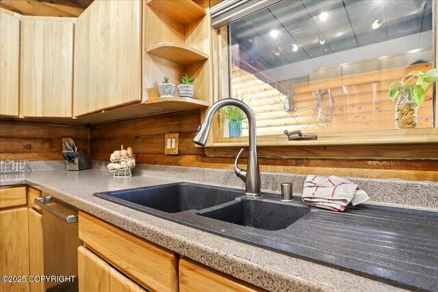 17720 Werre St, Chugiak, AK 99567 - kitchen with stainless steel dishwasher, a sink, light brown cabinets, and light countertops