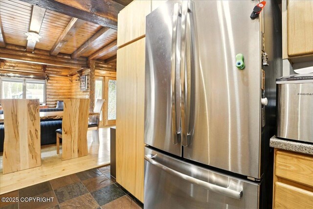 17720 Werre St, Chugiak, AK 99567 - kitchen featuring freestanding refrigerator, log walls, beamed ceiling, wooden ceiling, and light brown cabinets