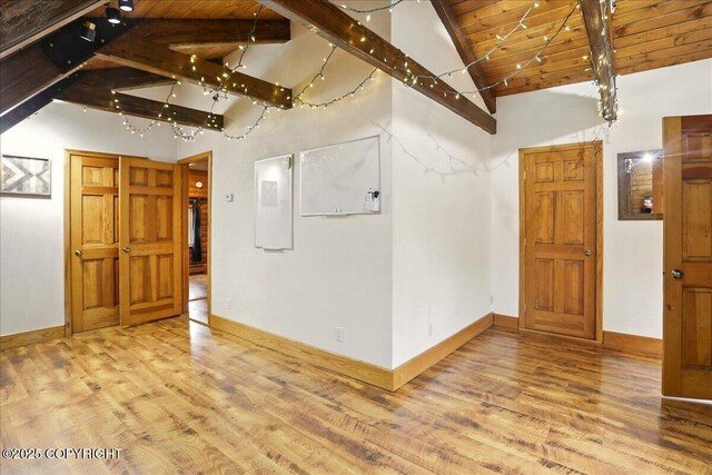 17720 Werre St, Chugiak, AK 99567 - spare room featuring wood finished floors, beam ceiling, baseboards, high vaulted ceiling, and wooden ceiling