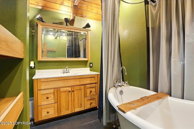 17720 Werre St, Chugiak, AK 99567 - bathroom featuring a freestanding bath, a textured wall, vanity, tile patterned floors, and a shower with curtain