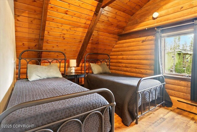 17720 Werre St, Chugiak, AK 99567 - bedroom featuring lofted ceiling, wood finished floors, log walls, and wooden ceiling