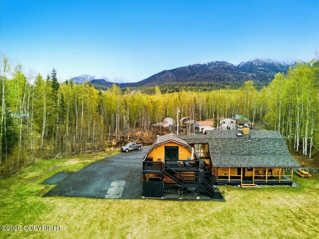 17720 Werre St, Chugiak, AK 99567 - back of property with a mountain view, a yard, a wooded view, and roof with shingles