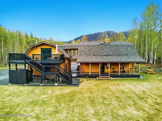 17720 Werre St, Chugiak, AK 99567 - rear view of property with stairs, a yard, a shingled roof, a chimney, and a deck with mountain view