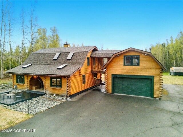 17720 Werre St, Chugiak, AK 99567 - cabin featuring log exterior, a gambrel roof, driveway, roof with shingles, and a chimney