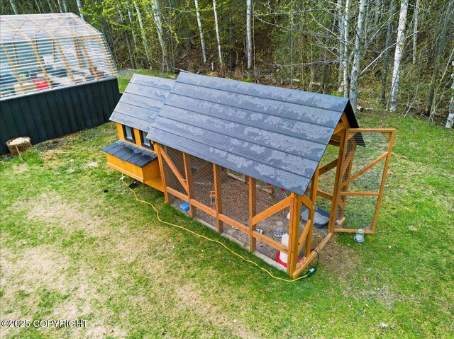 17720 Werre St, Chugiak, AK 99567 - view of grassy yard with exterior structure and an outbuilding