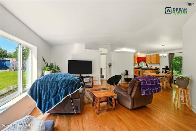1900 N Green Forest Dr, Palmer, AK 99645 - living area featuring a chandelier and light wood-type flooring