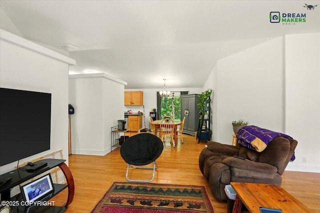 1900 N Green Forest Dr, Palmer, AK 99645 - living room with light wood-style floors and a chandelier