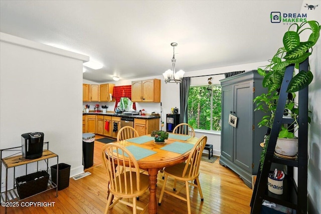 1900 N Green Forest Dr, Palmer, AK 99645 - dining room featuring a chandelier and light wood finished floors