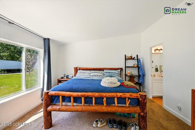 1900 N Green Forest Dr, Palmer, AK 99645 - carpeted bedroom featuring baseboards and ensuite bath