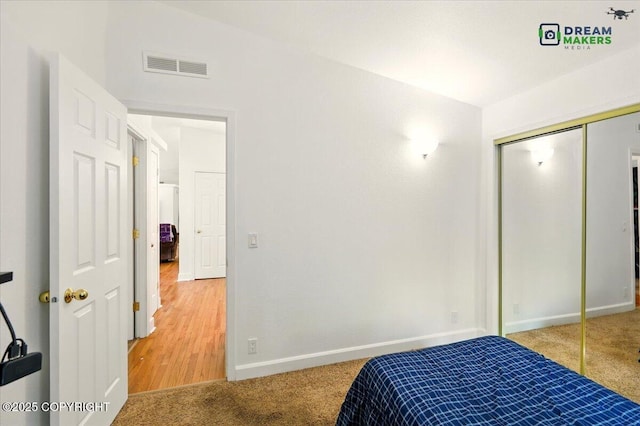 1900 N Green Forest Dr, Palmer, AK 99645 - carpeted bedroom with baseboards and a closet