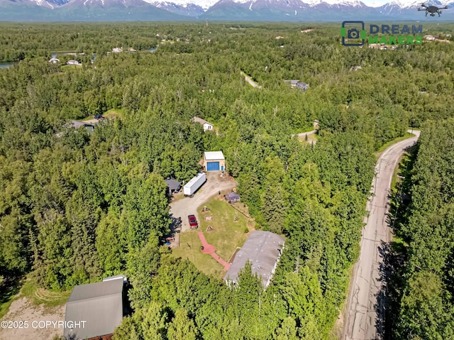1900 N Green Forest Dr, Palmer, AK 99645 - aerial view of a heavily wooded area and a mountainous background