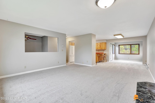 3211 Shamrock St, Anchorage, AK 99504 - unfurnished living room featuring light colored carpet and ceiling fan