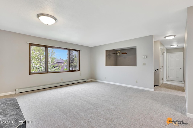 3211 Shamrock St, Anchorage, AK 99504 - spare room featuring baseboard heating, carpet floors, and a ceiling fan