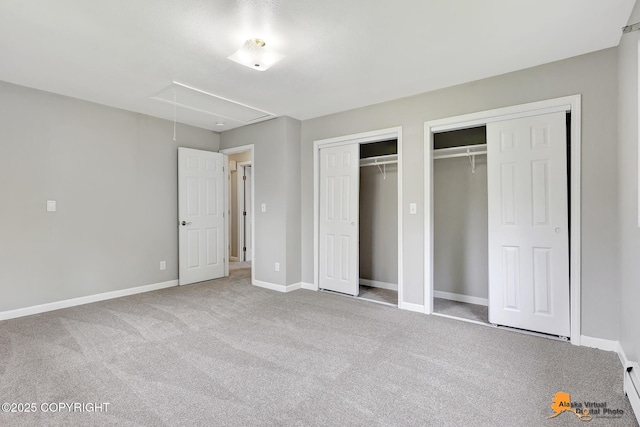 3211 Shamrock St, Anchorage, AK 99504 - unfurnished bedroom featuring attic access, multiple closets, and carpet flooring