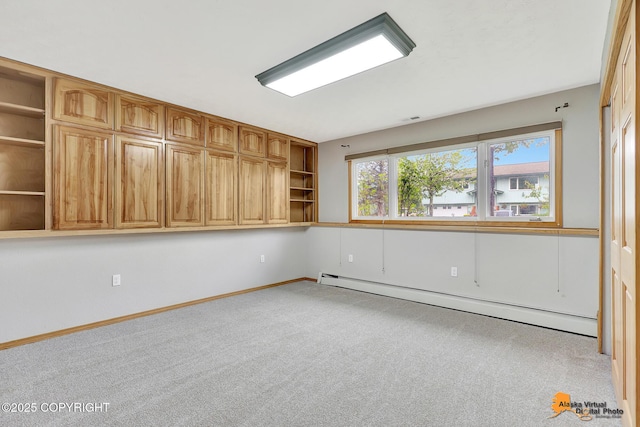 3211 Shamrock St, Anchorage, AK 99504 - carpeted empty room with baseboard heating and baseboards