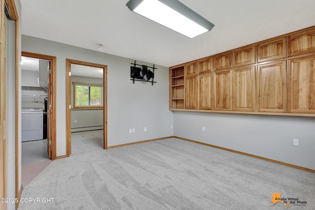 3211 Shamrock St, Anchorage, AK 99504 - empty room with washer / clothes dryer, baseboard heating, and light colored carpet