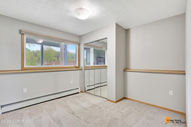3211 Shamrock St, Anchorage, AK 99504 - unfurnished bedroom featuring carpet floors and baseboard heating
