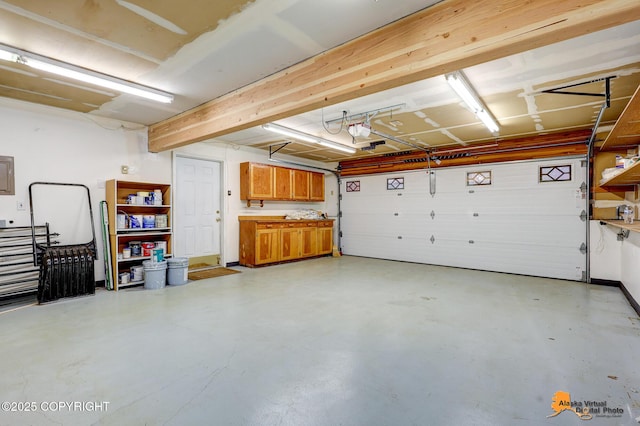3211 Shamrock St, Anchorage, AK 99504 - garage featuring a garage door opener