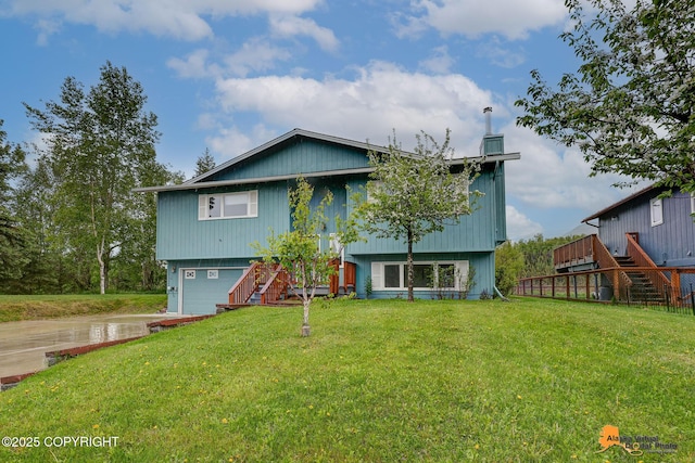 3211 Shamrock St, Anchorage, AK 99504 - view of front of property with stairs, an attached garage, a front yard, and driveway