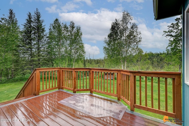 3211 Shamrock St, Anchorage, AK 99504 - wooden deck featuring a lawn
