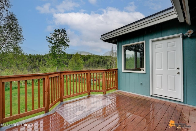 3211 Shamrock St, Anchorage, AK 99504 - wooden terrace featuring a lawn and a mountain view