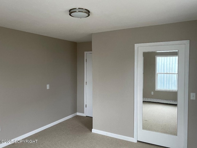 1069 Kiogak St, Barrow, AK 99723 - carpeted empty room with baseboard heating and baseboards
