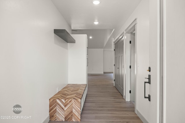 7177 N Paw St, Wasilla, AK 99654 - hallway with baseboards, recessed lighting, and light wood-style flooring