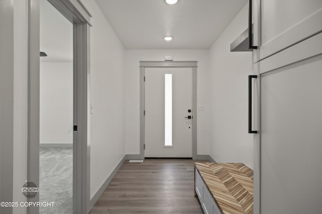 7177 N Paw St, Wasilla, AK 99654 - doorway to outside featuring recessed lighting, baseboards, and wood finished floors